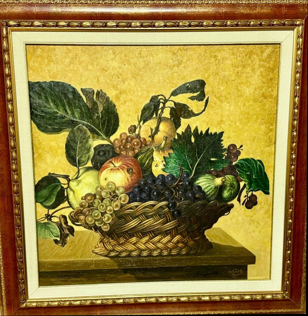 A woven basket filled with grapes, pears, apples, and leaves against a yellow background, in an ornate frame